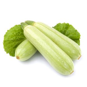 fresh vegetable marrow decorated with green leaf lettuce. isolated on white