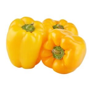 three fresh yellow bell peppers isolated on a white background.